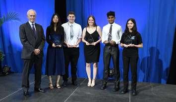 Awards presented to Anne McFadyen Scholarship recipients. From left to right: George McFadyen, Marissa Vu-Nguyen, Owen Roberts, Kyleigh Noels, Raihaan Abrahim, Maya Chaikam. June 12, 2025. (Photo courtesy of Great Lakes Secondary School)