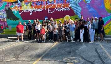 Community members with the artists of the new mural downtown Sarnia (Photo by: Lindsay Newman/ Blackburn Media)