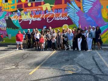 Community members with the artists of the new mural downtown Sarnia (Photo by: Lindsay Newman/ Blackburn Media)