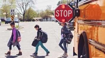 (Photo of children leaving a school bus courtesy of the Canadian Automobile Association)