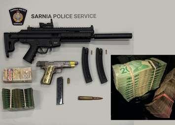 Weapons and cash seized from Aamjiwnaang First Nation by Sarnia police - May 8/25 (Photo courtesy of Sarnia Police Service)