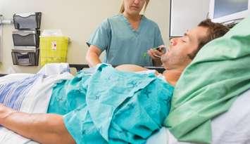 Nurse examining a patient in a hospital emergency room. © Can Stock Photo / Leaf