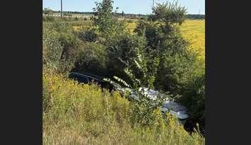 An SUV hauling a boat crashes into the ditch on Highway 402 at Forest Road - Sept. 9/25 (Photo Courtesy of OPP)